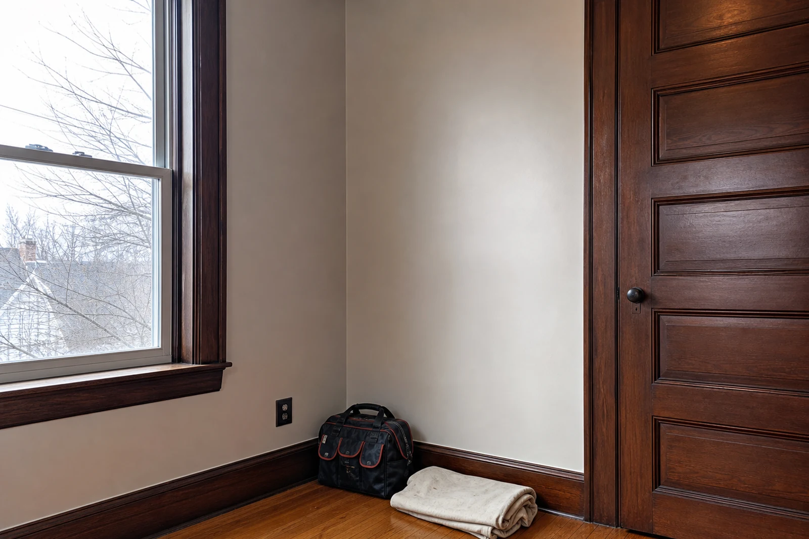Finished punch list handyman repairs in an older Woonsocket Rhode Island home with repaired plaster wall and restored wood trim